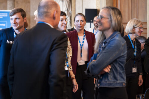 Participants chatting after opening ceremony