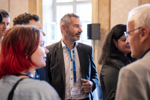 Participants chatting after opening ceremony