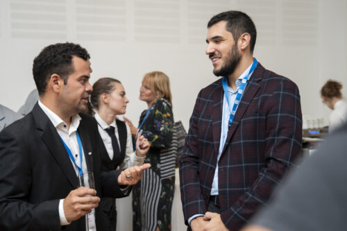 Participants chatting after opening ceremony