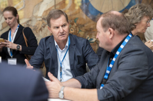 Participants chatting after opening ceremony