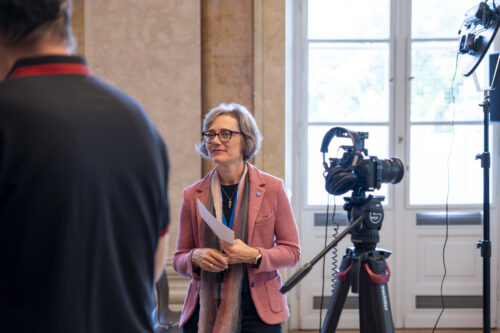 Karin Hofmann posing a question during the interview