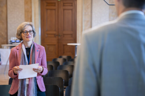 Karin Hofmann posing a question during the interview