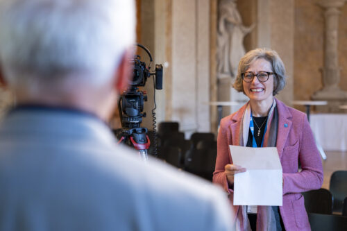 Karin Hofmann posing a question during the interview