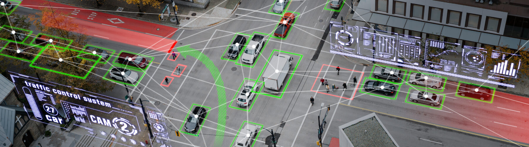 This picture depicts two crossing roads with several self-driving cars.