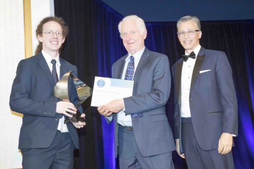 Thomas Blazek being handed the award by Dr. Truchard and Dave Wilson