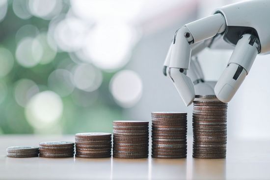 Robot hand stacking coins, symbolizing financial growth and investment