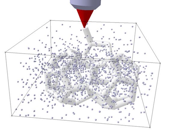 A laser hardens the liquid material exactly at the focal point.