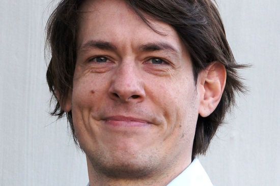 Tim Langen in front of gray background