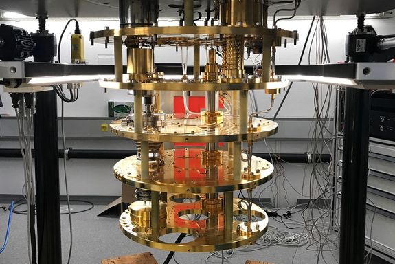 Five gold-plated circular copper plates attached to one another with glass fiber rods. Every plate has a different temperature. The bottom one is the mixing chamber plate with the lowest temperature of 5mK.