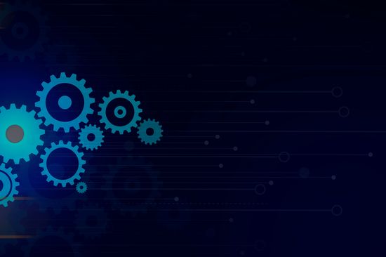 Große Zahnräder auf dem Hintergrund der Überschrift 