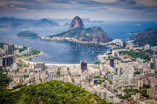  Panoramic view of Rio de Janeiro with Sugarloaf Mountain and the bay in the background.