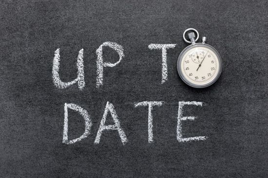 Text: Up To Date. The letter O is replaced by a stopwatch