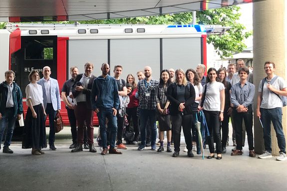 Group picture of participants in front of a fire engine at Open Science Day 2025