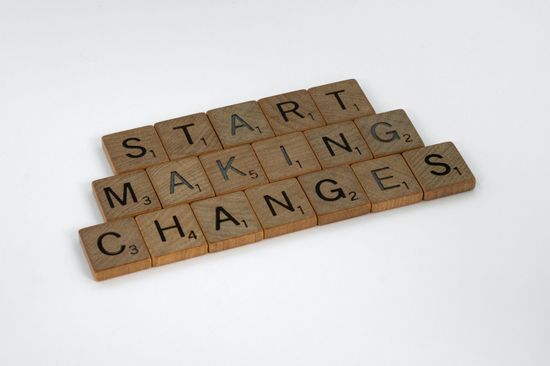 Scrabble letters spelling out the phrase ‘Start Making Change’