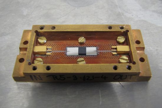 The Quantum Chip: In the center, there is the microwave resonator and the dark diamond.