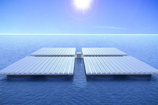 Drawing of four square platforms swimming in the sea showing the HELIOFLOAT Platform, a light-weight structure with high swimming stability.  The platform system can be used for solar power generation (CSP, PV, CPV), for marine biotech cultures, desalination plants, offshore housing, sports and event locations, for floating stages, anchoring places and heliports  with a link to PDF "HELIOFLOAT Platform" 