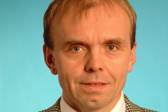 Markus Haider Portrait photo of Markus Haider on the bright blue background