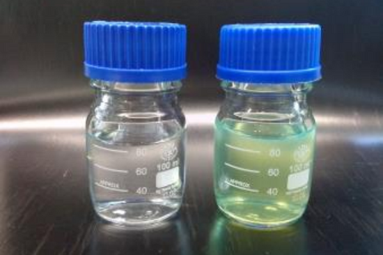Two small screw-top jars of liquid with ink to PDF "Improving methanogenesis by pervaporation"