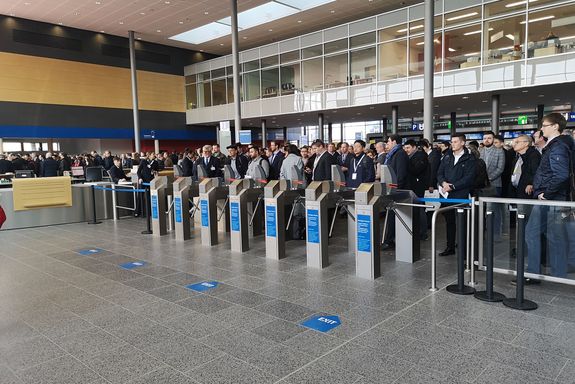 Entrance - first day - Hannover Messe 2019 dozens of people waiting at the entrance hall for the start of the Hannover Messe 2019.