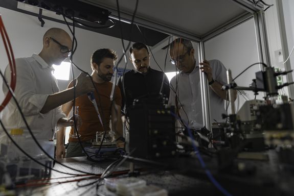 four people in the lab