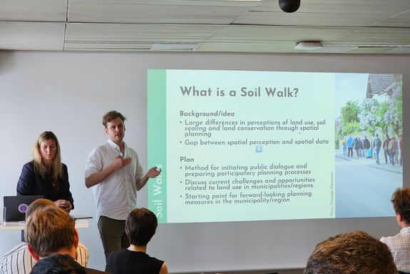 Two speakers and audience at Open Science Day 2025