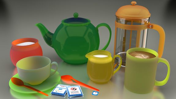 [Translate to English:] Plastiklöffel, mattes und glänzendes buntes Glasgeschirr, Teebeutel in Papier – alles spiegelt sich in der Tischplatte. Großansicht von Foto 1.