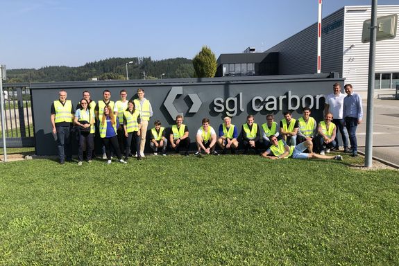 Students in front of SGL Logo