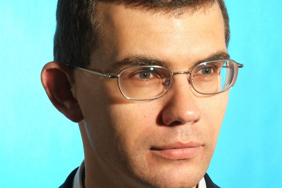 Andrius Baltuska portrait photo of Andrius Baltuska on the bright blue background