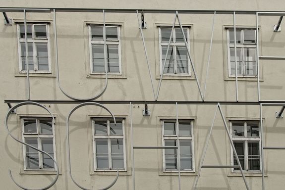 Facade of the Favoritenstrasse building with the TU Wien logo in front of it
