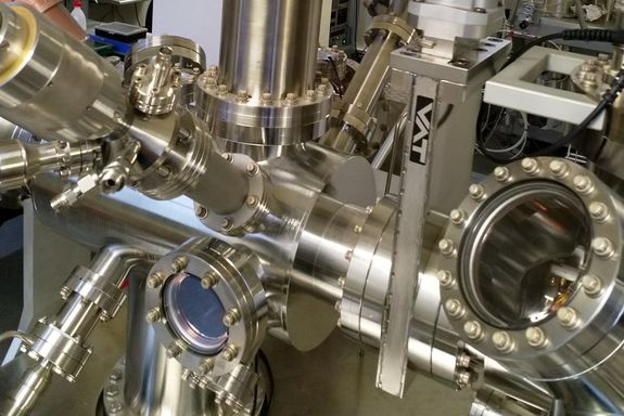 vacuum chambers with nuts and bolts and glass windows