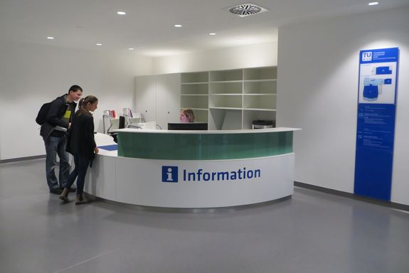 Information desk with two customers