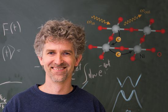 Jan Kunes in front of the blackboard