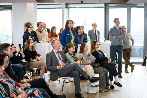 View of the audience, Rector Schneider at the presentation, futurefit posters visible in the foreground to the side