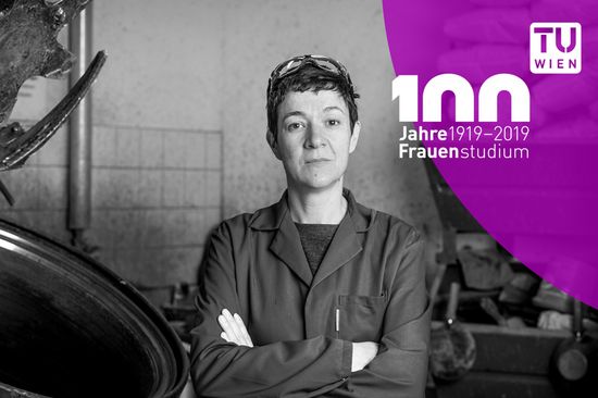 Female researcher standing to the right of a large concrete mixer