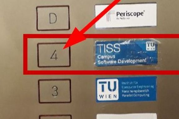 4. Floor - TISS Arrow points to button for the 4th floor in the elevator
