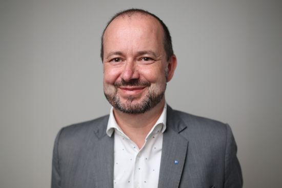 a man with a gray jacket