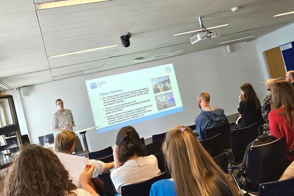 A speaker and audience at Open Science Day 2025