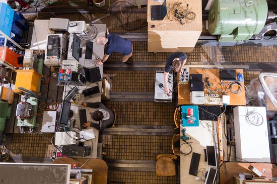 A bird's eye view of an electrical engineering laboratory with several people at work