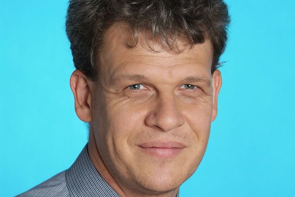 Christoph Herwig Portrait photo of Christoph Herwig on the blue background