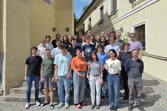 group of people standing on stairs, picture taken outside