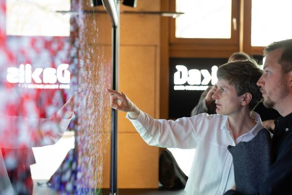 Guests testing the interactive touch wall