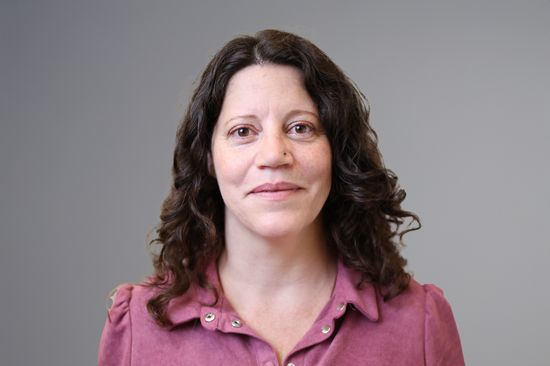a woman with a pink blouse