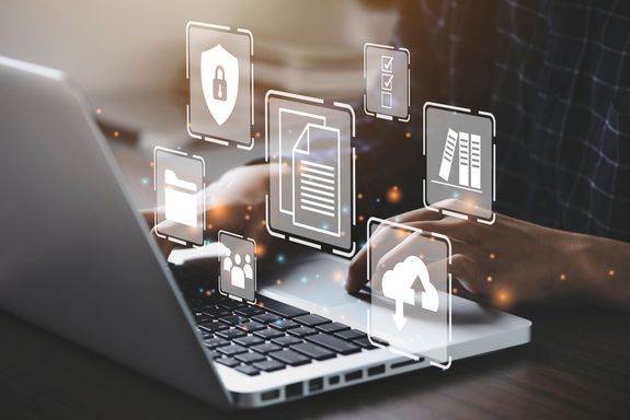 Photo of a person at a laptop, supplemented with Open Science symbols.