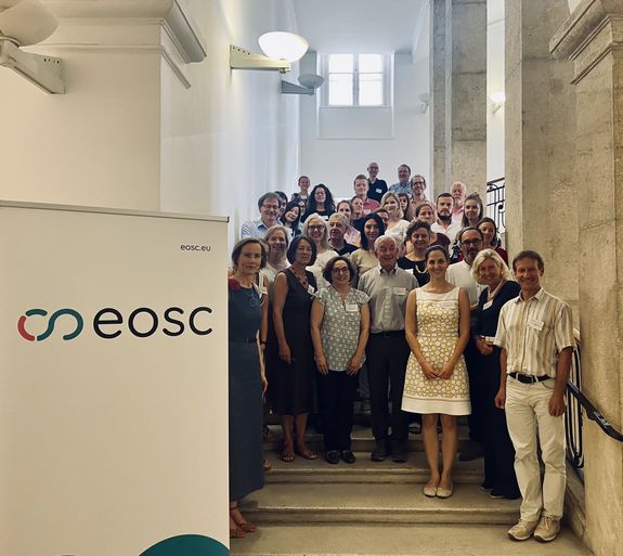Project Partners standing at the staircase of TU Wien main building