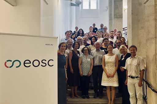 Project Partners standing at the staircase of TU Wien main building