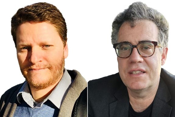 Porträtbilder (Brustbilder) ohne Hintergrund von Giancarlo Guizzardi und Thomas Haigh. Beide tragen ihre Haar kurz, Haigh eine Brille mit schwarzem Rahmen. Er hat graues Haar. Guizzardi hat rotes Haar und trägt einen kurz geschnittenen Vollbart