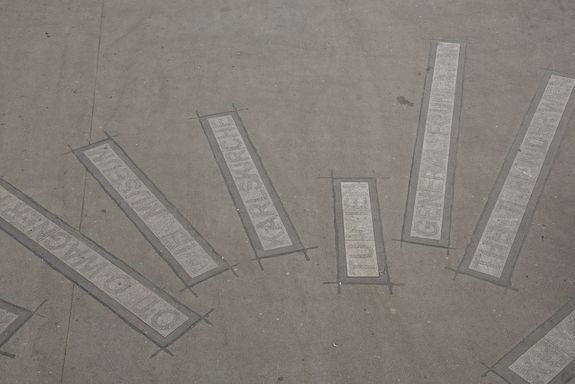 Schriftzug Karlsplatz Ground markings on the road that indicate the directions. For example TU Wien, Karlskirche, Wien Museum etc.