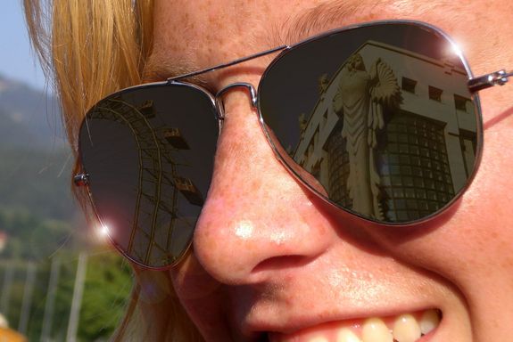 Reflection from the TU Vienna Library in the glasses of a young woman