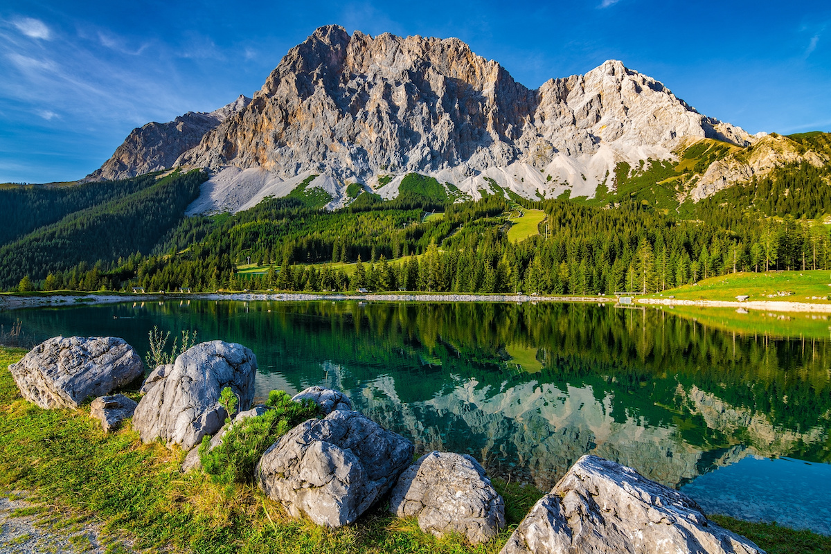A beautiful view on the Ehrwalder Almsee and the Zugspitze on a sunny summer day in Austria