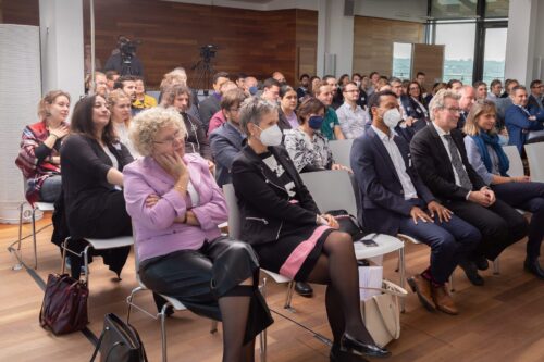 Participants watching John Warner's video statement